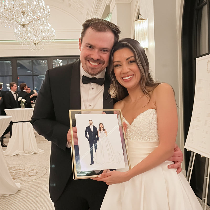 Bride and groom posing with their custom live wedding illustration at Le Tesserae in Houston.